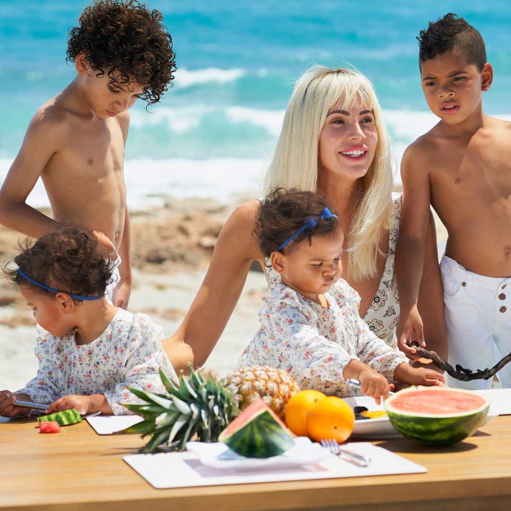 Hope Dworaczyk Smith and her children enjoy beach time in Palm Beach.