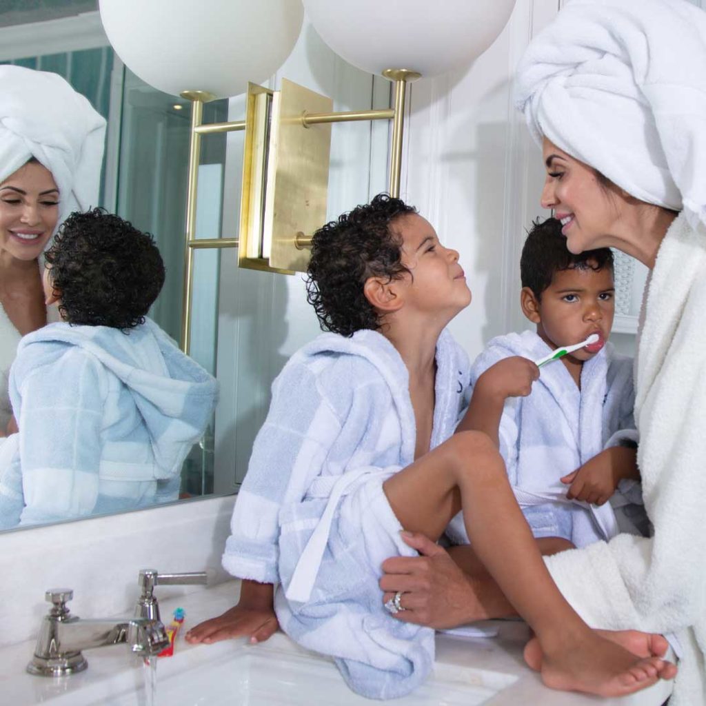 Hope Dworaczyk Smith with sons as they get ready in the bathroom.