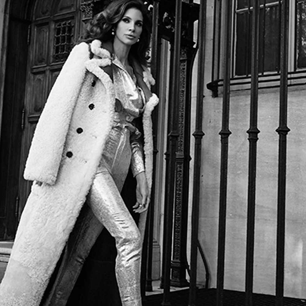 Hope Dworaczyk Smith models white coat from luxury designer Chloé.