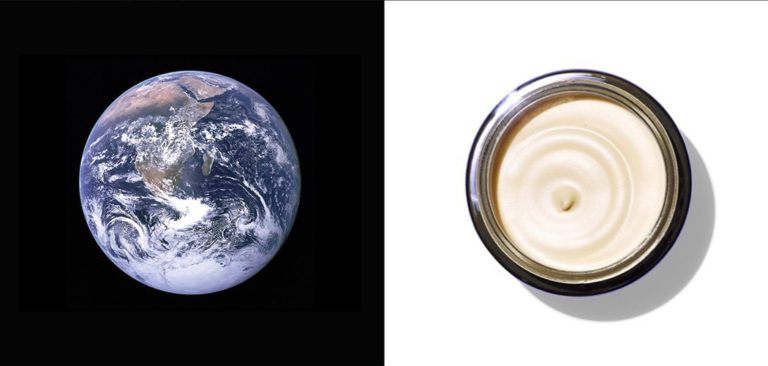 An image of the whole earth seen from orbit is contrasted with an image of a round open container containing moisturizing cream