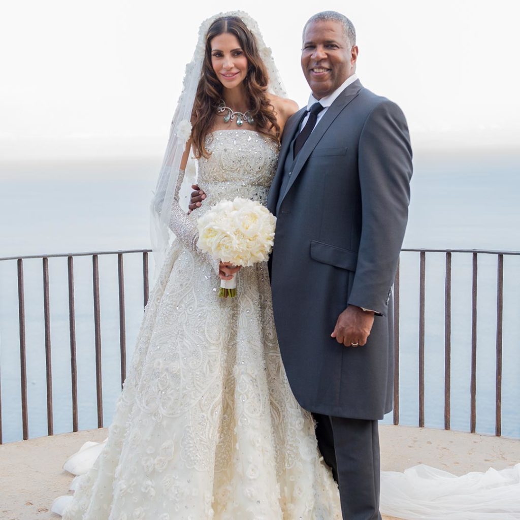 Hope Dworaczyk wears her wedding dress designed by Naeem Khan with her husband Robert F. Smith