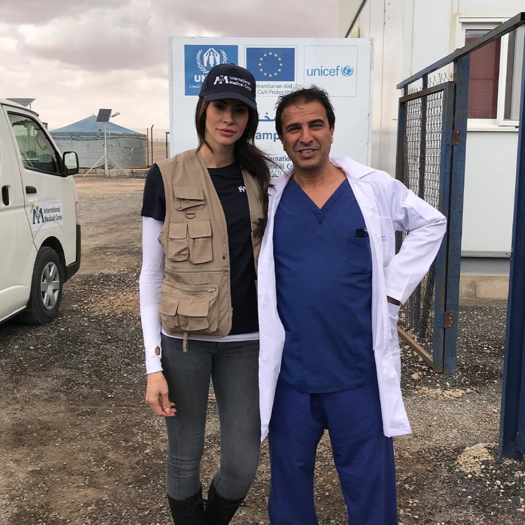 Hope Dworaczyk stands with an International Medical Corps doctor in Jordan