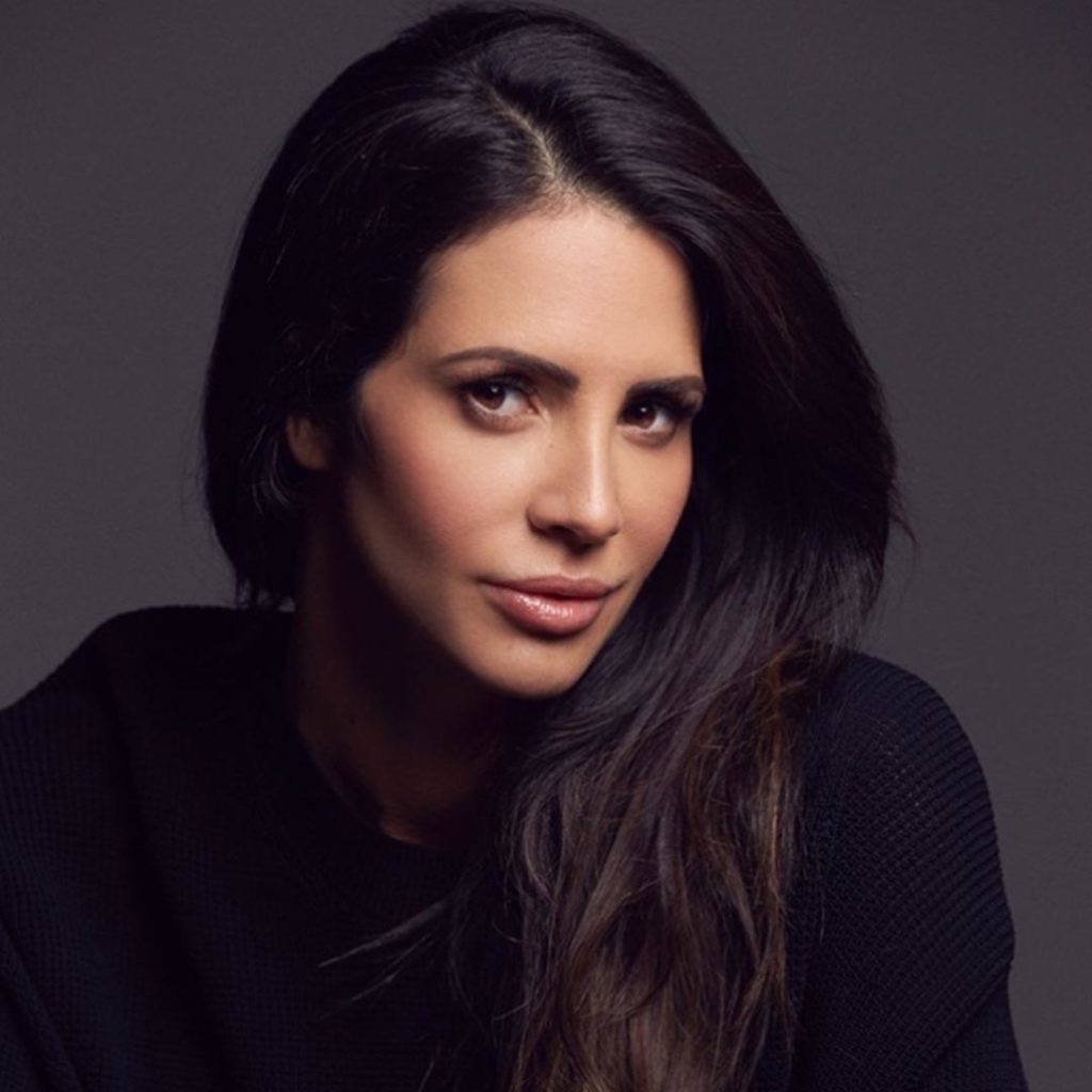 Headshot of Hope Dworaczyk in a color photo wearing a black turtleneck