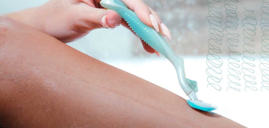 A woman shaves her leg with a light blue disposable razor.