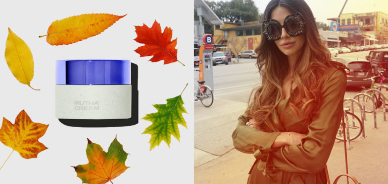 A jar of MUTHA™ Cream sits surrounded by fall leaves on the left. On the right, Hope stands in a brown jacket with large black vintage sunglasses on, with her arms crossed.