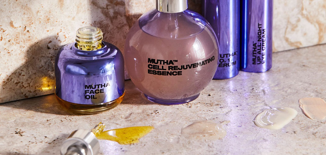 MUTHA™ products along with sample drops sit on a bathroom counter.