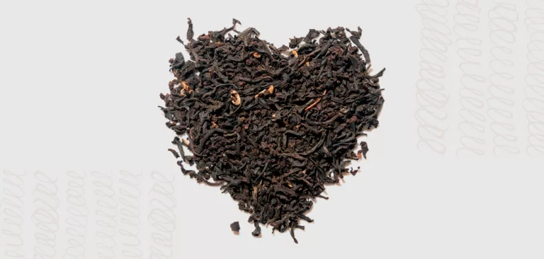 A heart made out of black tea leaves.